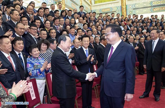 Chinese Premier Li Keqiang meets delegates at the second overseas Chinese industrial and commercial congress in Beijing, capital of China, June 12, 2017. (Xinhua/Li Xueren)